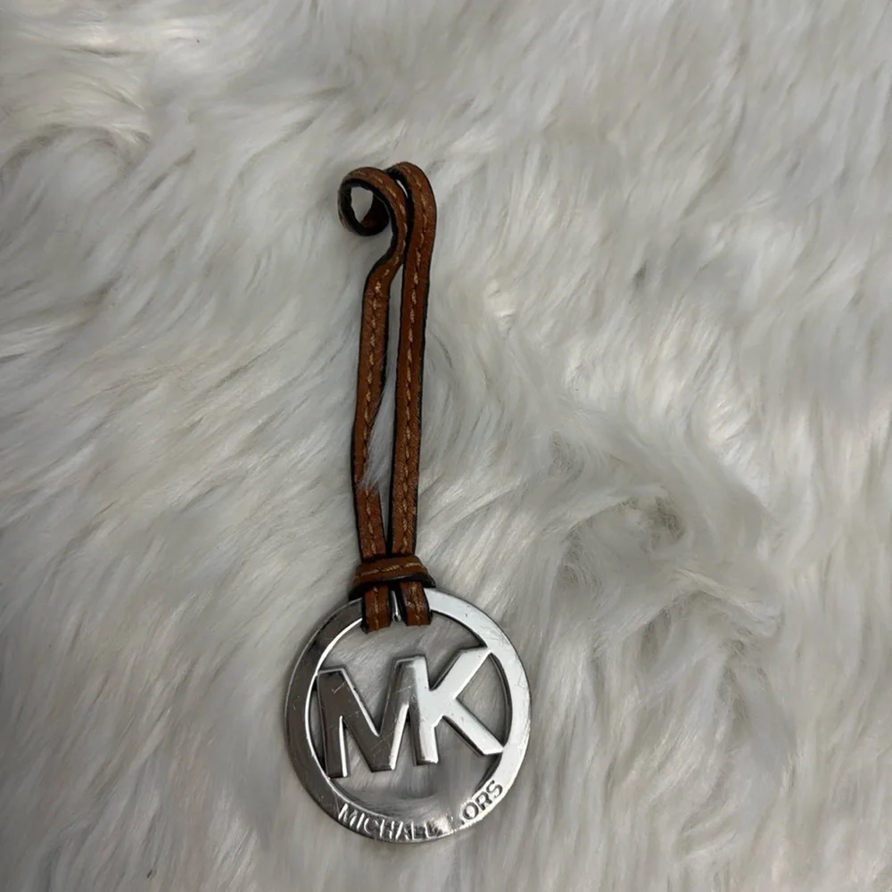 Michael Kors Fob Hang Tag Silver Color Metal Logo on Cognac Brown Leather Strap